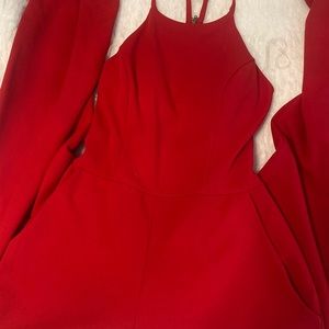 Brand new with tags, beautiful jumpsuit size xs! Has lace in back
